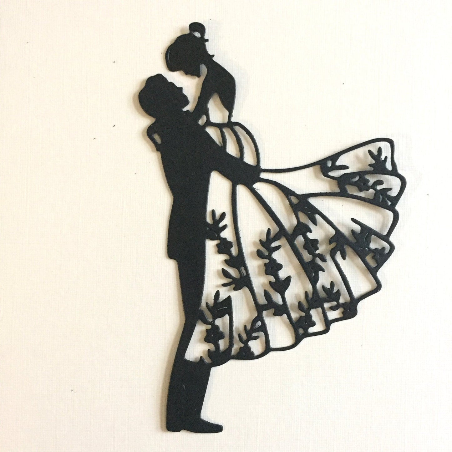 groom lifting bride intricate silhouette die cut