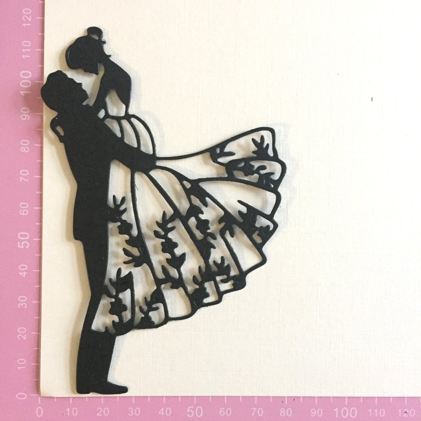 groom lifting bride intricate die cut showing measurements