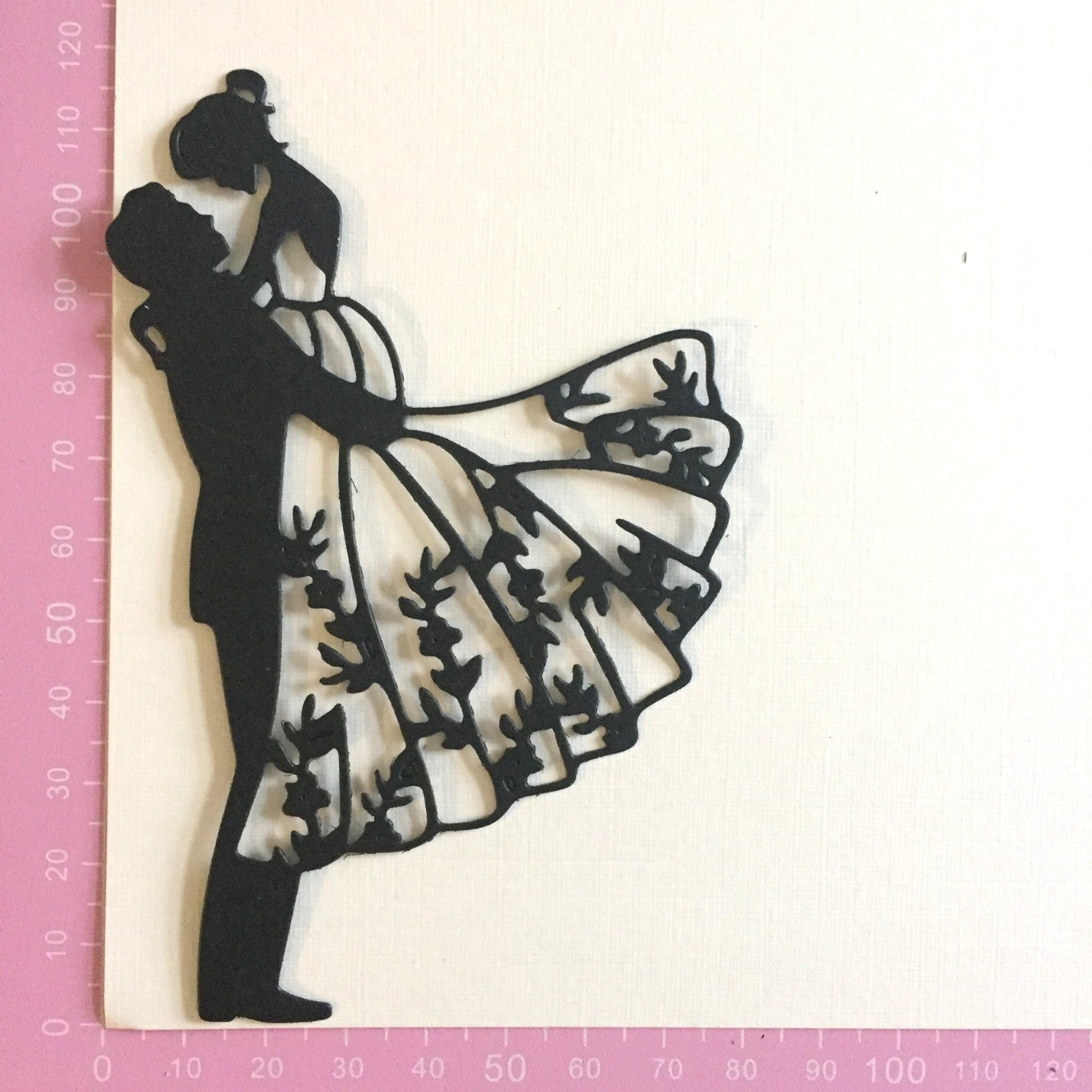 groom lifting bride intricate die cut showing measurements