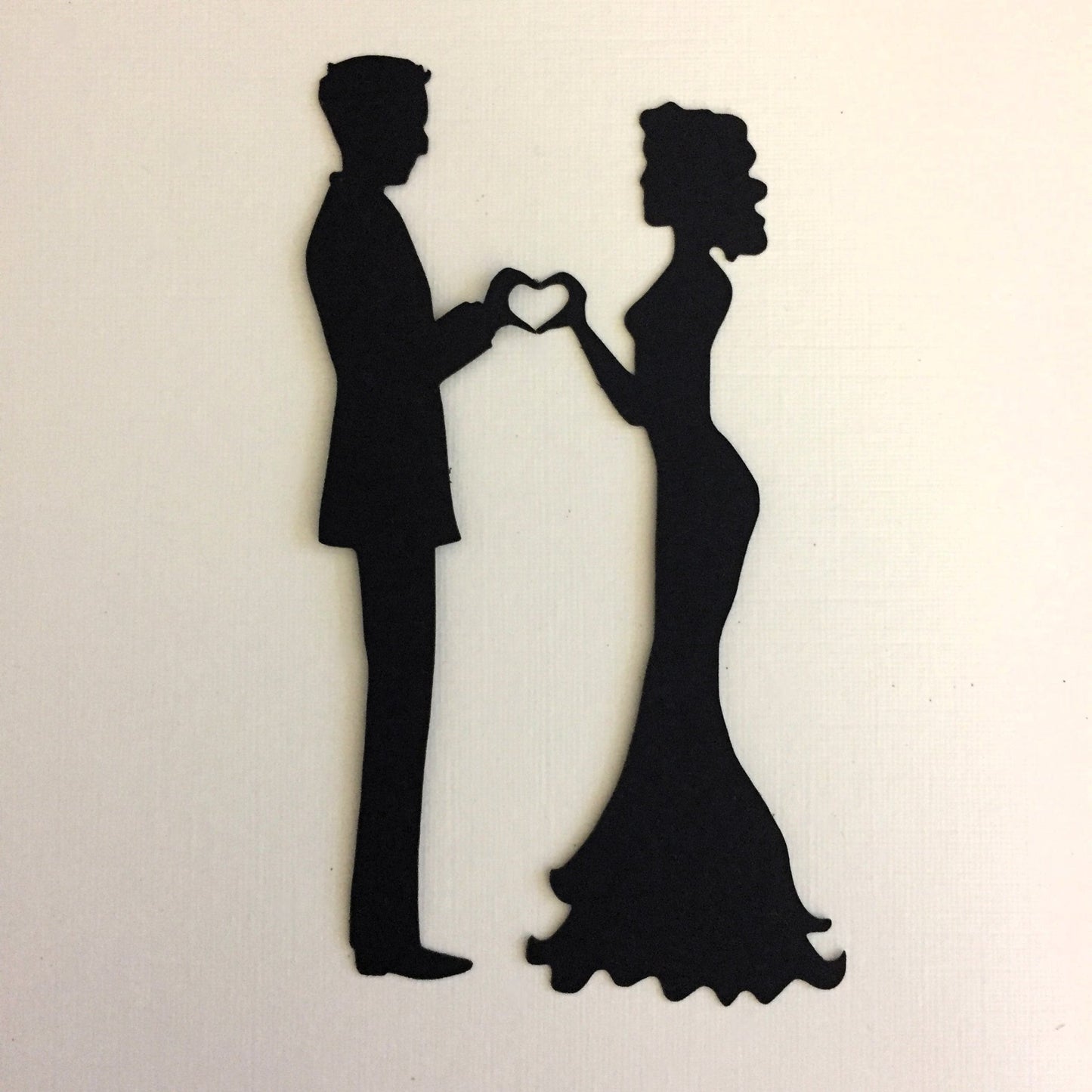 Black Bride and groom die cut making a heart with their hands